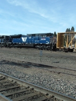 MRL 4312 SD70ACe dumping off cars at
